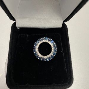 14k white gold Pendant with Sapphire and diamonds.
